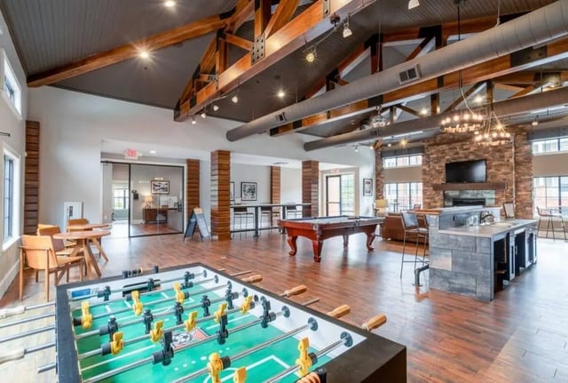 Foosball table pool table bar lounge living room at The Province Greensboro in Greensboro Student Accommodation