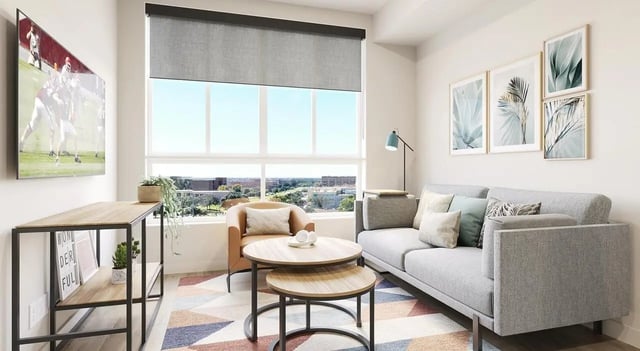 Sofa chair coffee tables artwork tv console living room at Aspire Reserve in College Station Student Accommodation