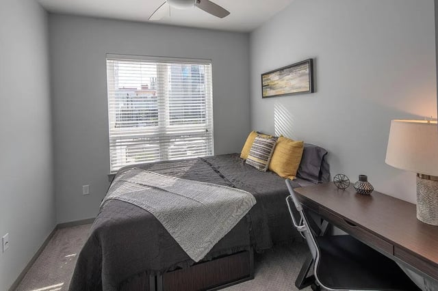 Bed desk with lamp and chair bedroom at Theory Syracuse in Syracuse Student Accommodation