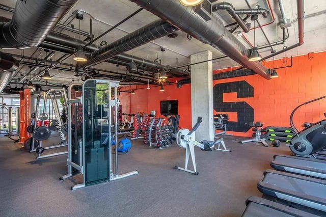 Gym equipment including treadmills weights and machines gym at Theory Syracuse in Syracuse Student Accommodation