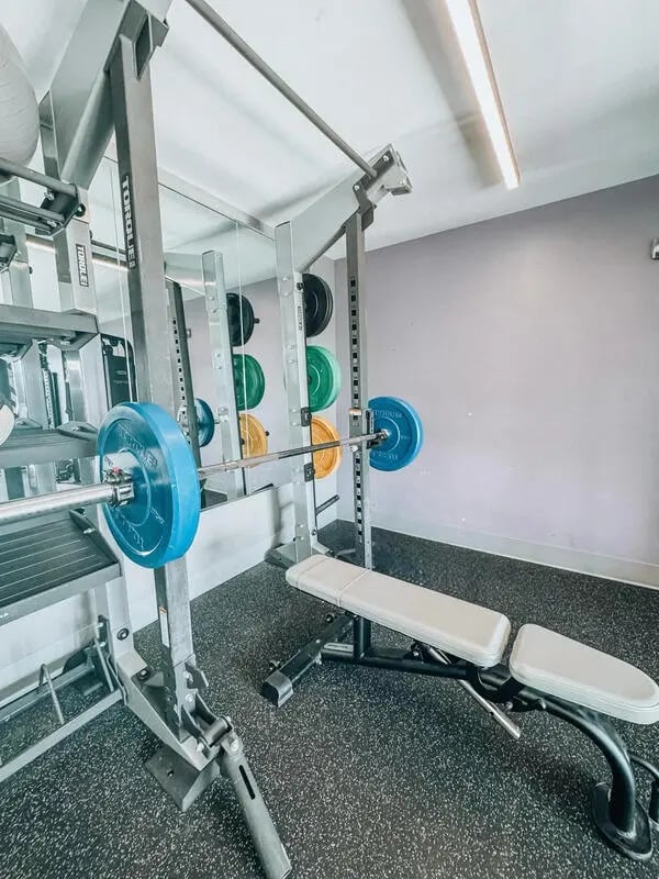 Weight rack barbell bench and weights gym area at Altitude Baton Rouge | Apartment Complex in Baton Rouge Student Accommodation