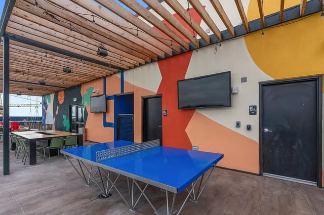 Ping pong table and dining set exterior at The Dean Campustown in Champaign Student Accommodation