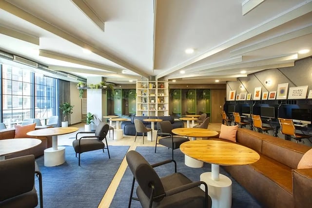 Modern lounge area with computers study booths and living room at The Dean Campustown in Champaign Student Accommodation