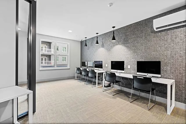 Computers and chairs in a communal study area at Bixby Kennesaw in Kennesaw Student Accommodation