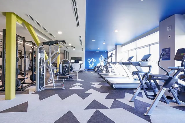 Weight machines treadmills and elliptical gym facility at Bixby Kennesaw in Kennesaw Student Accommodation