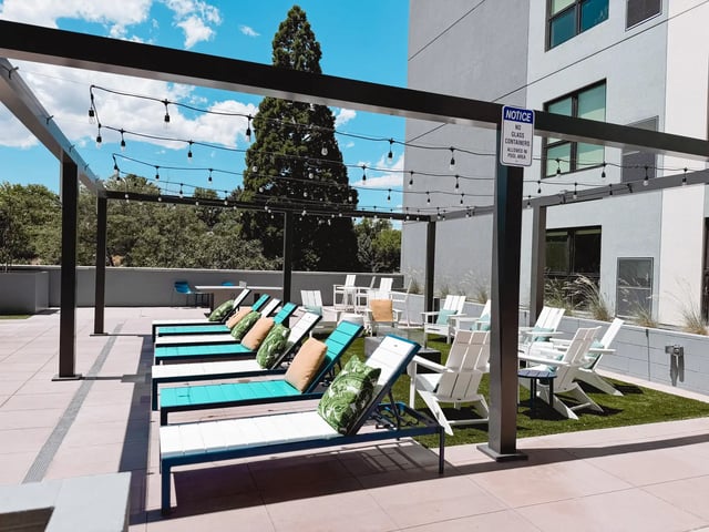 Loungers chairs lights and tables exterior at The Dean Reno in Reno Student Accommodation