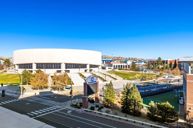 Campus stadium grass field trees buildings exterior at The Dean Reno in Reno Student Accommodation