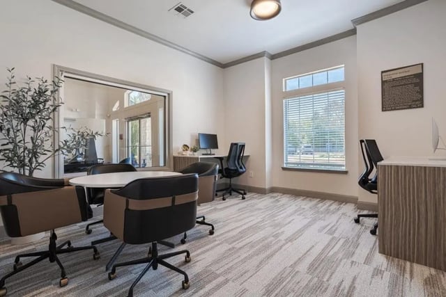 Study area with chairs and computers living room at Crossing Place in College Station Student Accommodation