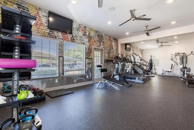 Gym equipment treadmills weight rack punching bag fitness gym at Crossing Place in College Station Student Accommodation