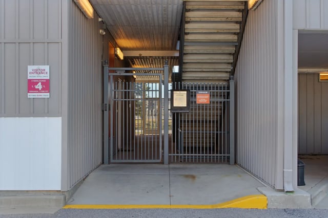 Visitor entrance gates metal stairs exterior at The Q'ube in Springfield Student Accommodation
