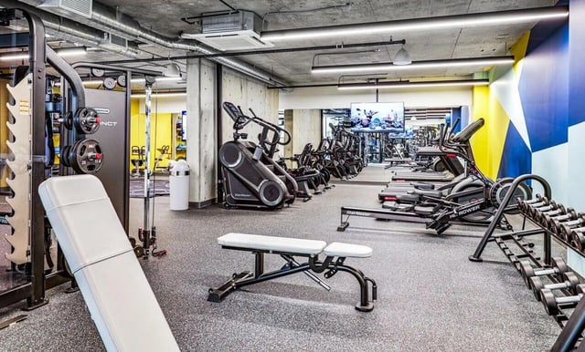 Weight machines treadmills and dumbbells gym area at Theory U District in Seattle Student Accommodation