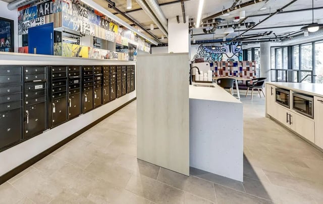 Mailboxes counter with microwaves and seating area kitchen at Theory U District in Seattle Student Accommodation