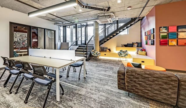 Study area with desks and seating lounge area at Theory U District in Seattle Student Accommodation