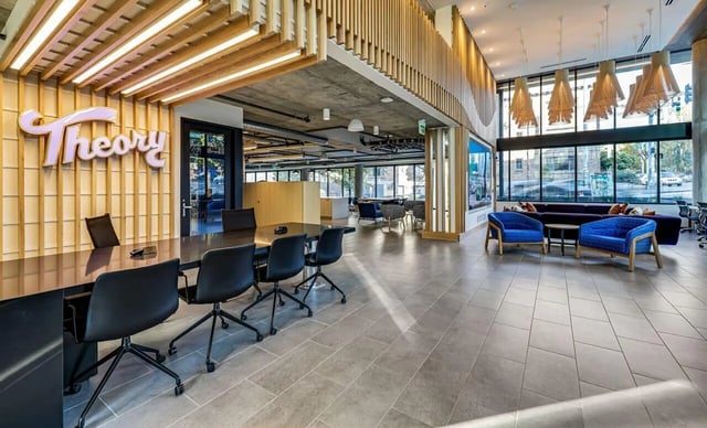 Conference table with chairs and lounge area. Lounge area. at Theory U District in Seattle Student Accommodation