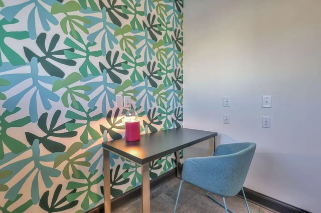 Desk lamp chair patterned wallpaper study area at Cobalt Row in Murfreesboro Student Accommodation