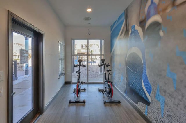Two stationary bikes workout room interior at Cobalt Row in Murfreesboro Student Accommodation