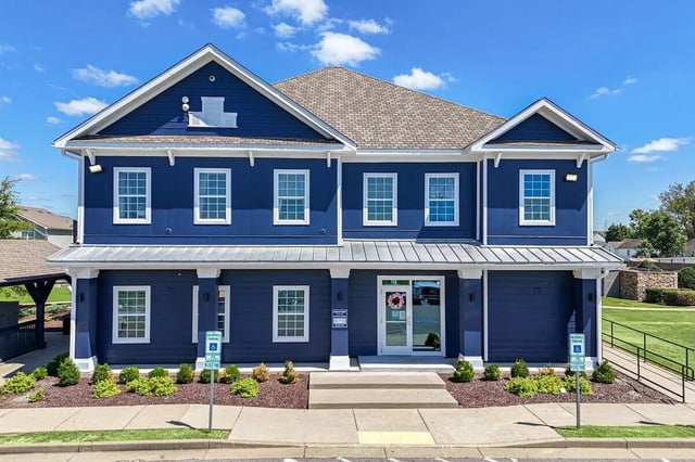 Blue building with white trim and windows exterior at Cobalt Row in Murfreesboro Student Accommodation