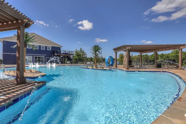 Pool with building palm trees and pergola swimming area at Cobalt Row in Murfreesboro Student Accommodation