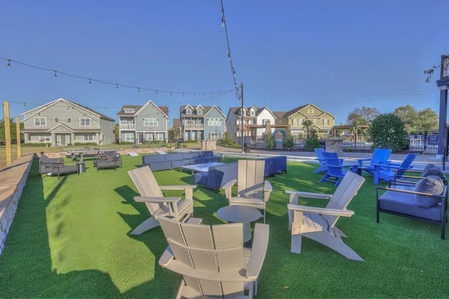 Outdoor seating area with Adirondack chairs playing area at Cobalt Row in Murfreesboro Student Accommodation