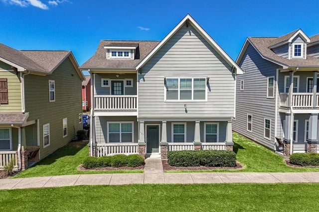 Townhouses with balconies and green lawn exterior at Cobalt Row in Murfreesboro Student Accommodation