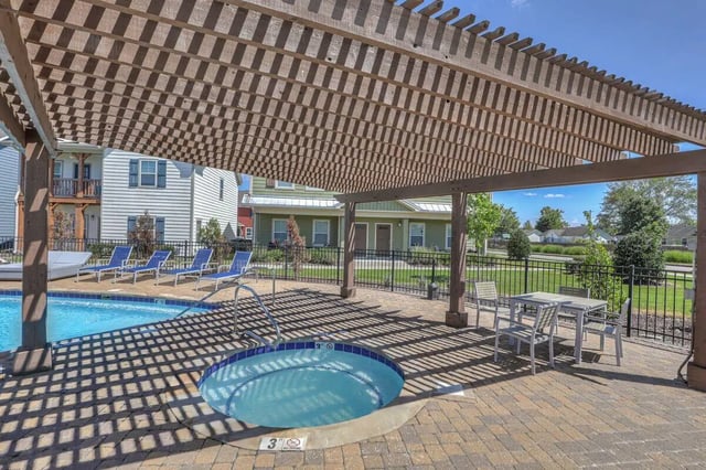 Pool hot tub lounge chairs patio table exterior at Cobalt Row in Murfreesboro Student Accommodation