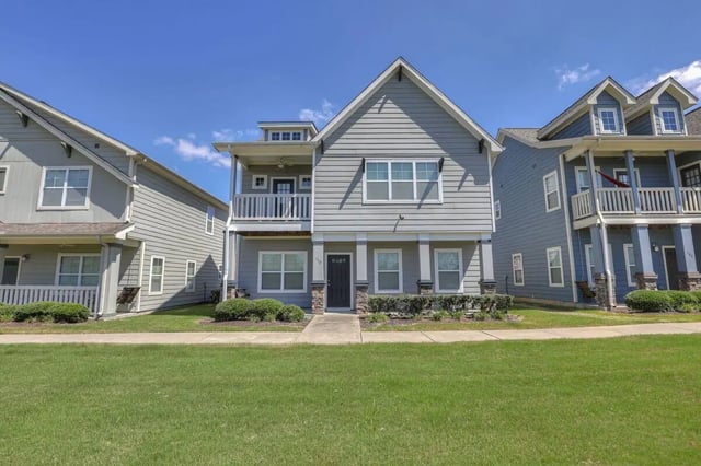 Two story grey apartment buildings with balconies exterior at Cobalt Row in Murfreesboro Student Accommodation