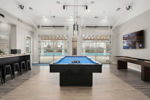 Pool table shuffleboard bar stools television recreation area at The Gathering in Salisbury Student Accommodation