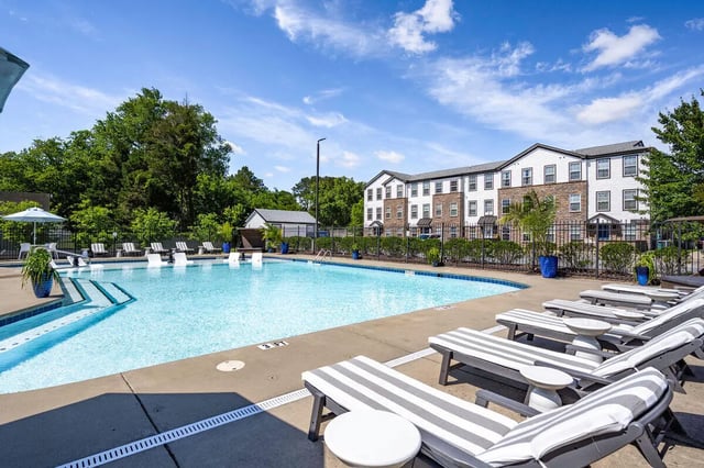 Loungers by sparkling pool exterior at The Gathering in Salisbury Student Accommodation