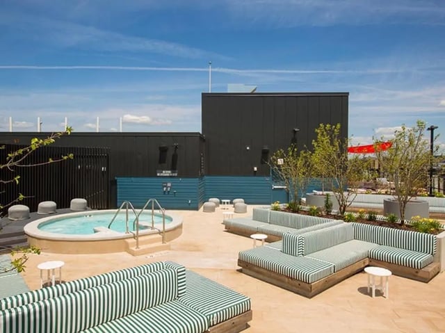 Hot tub and striped lounge seating outdoor area at The James in Richmond Student Accommodation