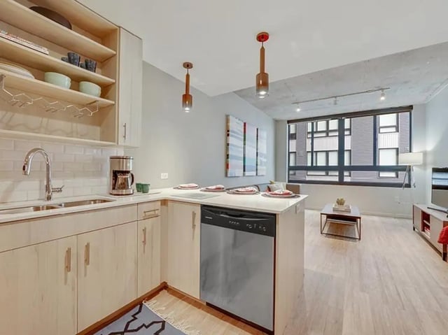 Modern kitchen with island living area living room at The James in Richmond Student Accommodation