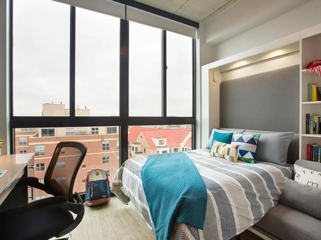 Bed desk chair backpack and windows bedroom at The James in Richmond Student Accommodation