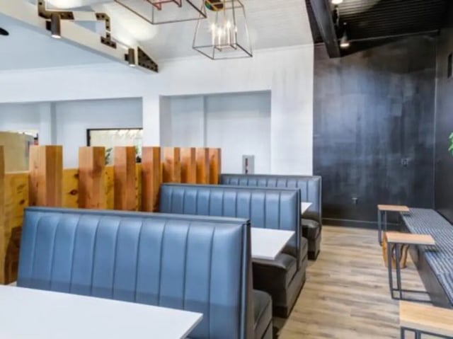 Blue booths and wooden dividers communal area at East Edge in Tuscaloosa Student Accommodation