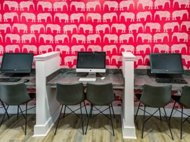 Computers and chairs at desks study area at East Edge in Tuscaloosa Student Accommodation