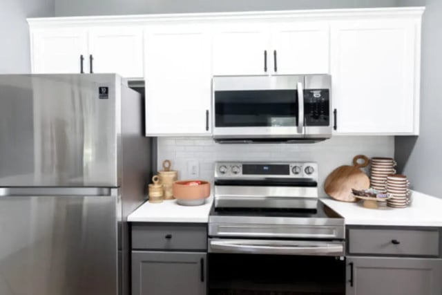 Stainless steel fridge microwave stove kitchen. at East Edge in Tuscaloosa Student Accommodation