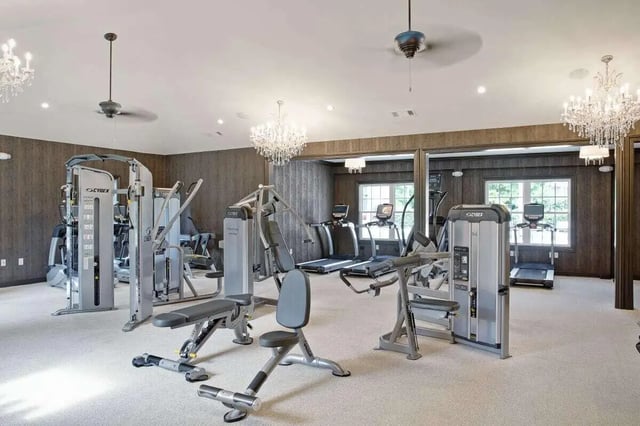 Exercise machines treadmills and weight benches gym at The George in Statesboro Student Accommodation