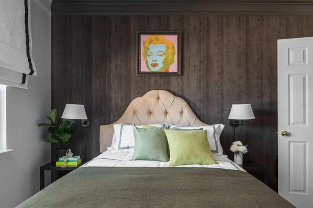 Tufted headboard Marilyn Monroe art and two lamps bedroom at The George in Statesboro Student Accommodation