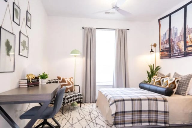 Desk chair patterned chair bed and city art bedroom at East Edge in Tuscaloosa Student Accommodation
