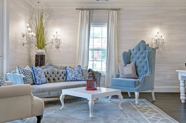 Sofa armchair white coffee table living room at The George in Statesboro Student Accommodation