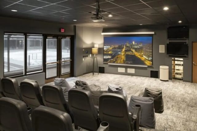 Theater seating bean bags and projection screen living room at The Quad On Delaware in Minneapolis Student Accommodation