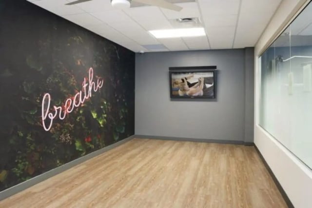 Neon breathe sign artwork and window living room at The Quad On Delaware in Minneapolis Student Accommodation