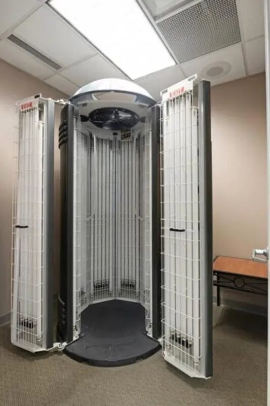 Tanning bed with open doors and lights tanning bed room at The Quad On Delaware in Minneapolis Student Accommodation