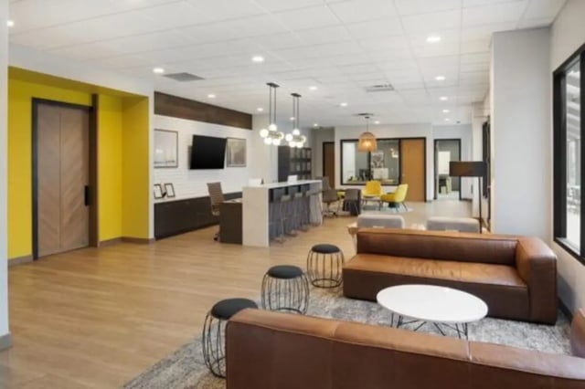 Leather sofas bar stools and workstations common area at The Quad On Delaware in Minneapolis Student Accommodation