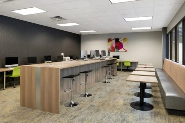 Computers bar stools and tables study area at The Quad On Delaware in Minneapolis Student Accommodation