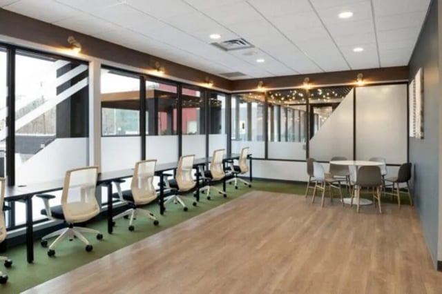 Desks chairs round table study area at The Quad On Delaware in Minneapolis Student Accommodation