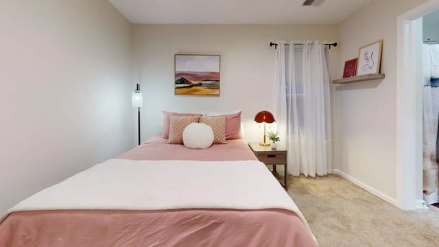 Pink bed with pillows floor lamp artwork bedside table Bedroom at Block20