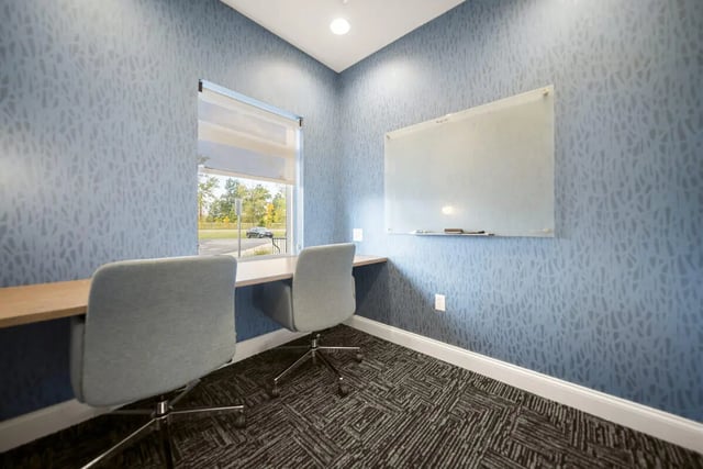 Two chairs desk window whiteboard study area at Block20