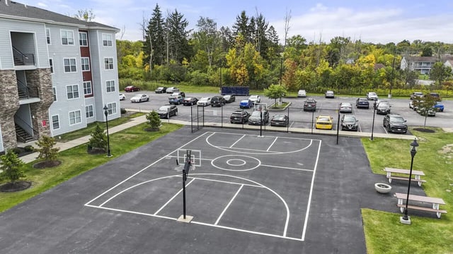 Basketball court with benches and parking lot exterior at Block20