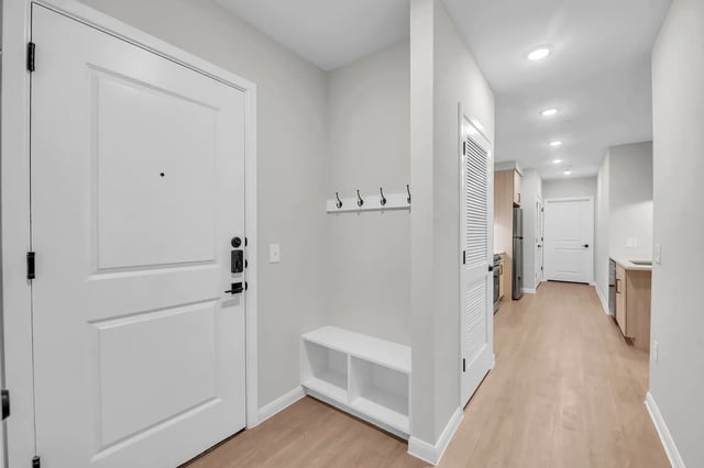 White bench coat rack and door hallway at The Sinclair in Austin Student Accommodation