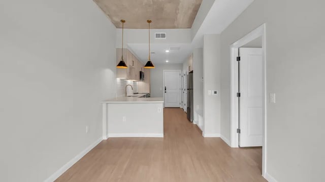 Modern kitchen with pendant lights and appliances kitchen at The Sinclair in Austin Student Accommodation