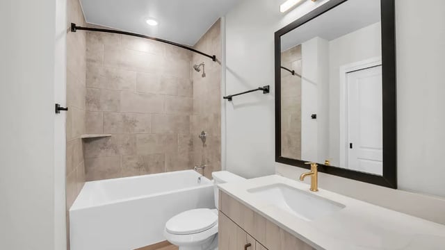 Toilet bathtub vanity mirror and shower bathroom at The Sinclair in Austin Student Accommodation